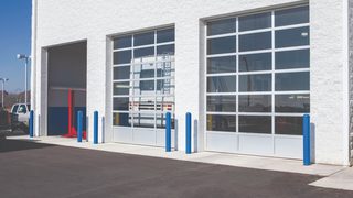 Automotive facility with aluminum sectional doors
