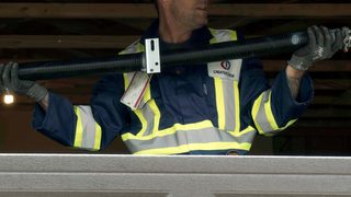 CDS technician holidng new garage door spring