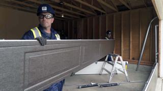 CDS technician installing a garage door panel