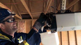 CDS technician installing garage door opener