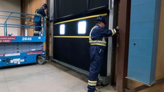 CDS technicians maintaining commercial door tracks