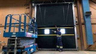CDS technicians servicing loading dock door