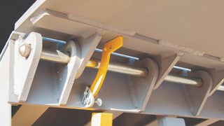 Dalton Dock pit leveler mechanism beneath loading dock platform