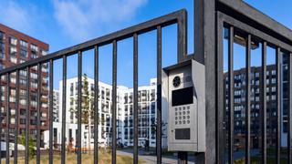 Electronic lock with buttons and intercom on the metal fence gate