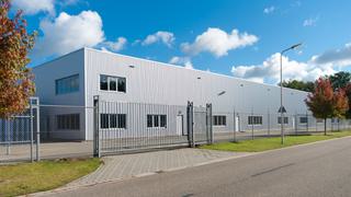 Industrial building with gate and fence