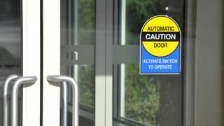 Automatic Door With Warning Sign Min