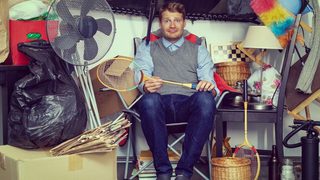 Confused man messy garage min