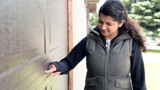 Homeowner troubleshooting garage door problems