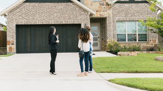 Real Estate Agent Outside Home Min