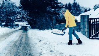 Senior Shoveling Snow Gate Min