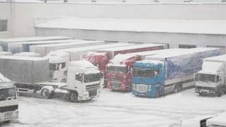 Trucks Busy Warehouse Winter Storm Min