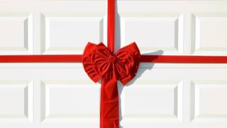 White Garage Door With Big Red Bow