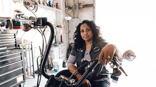 Woman In Motorcycle In Garage Min