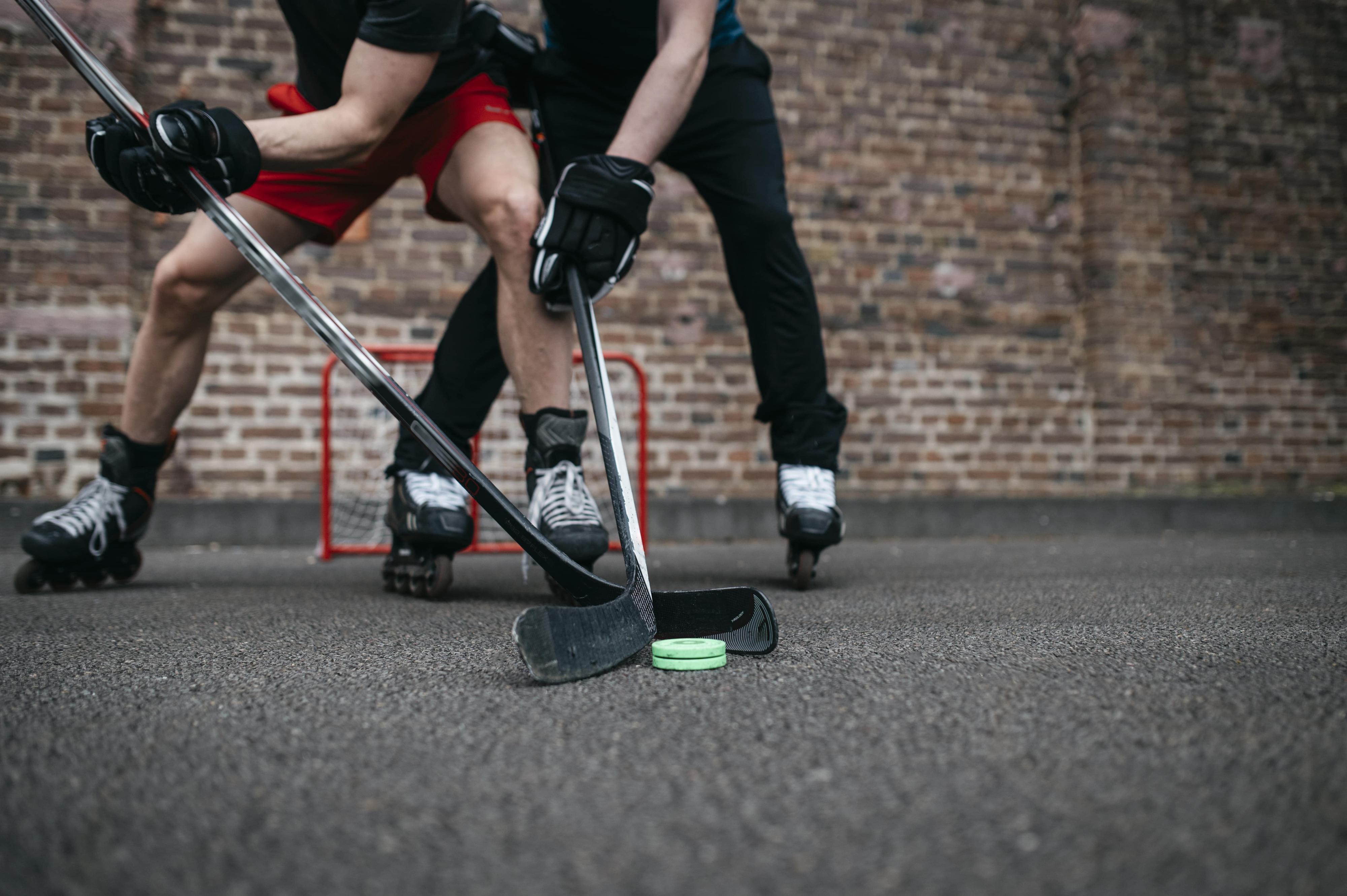 using soft pucks playing street hockey in home's driveway
