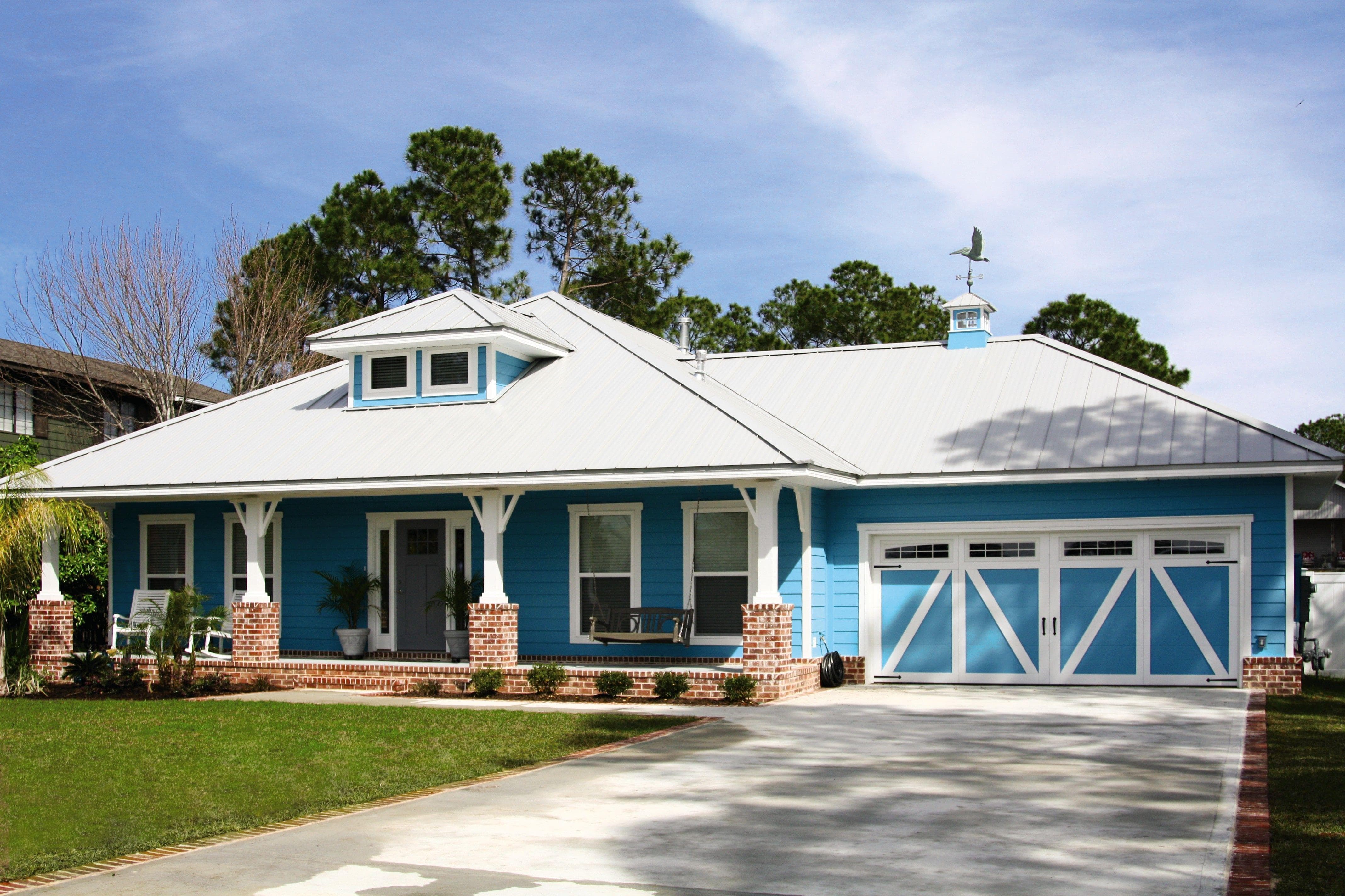 beautiful sky blue painting on home and ranch style garage doors