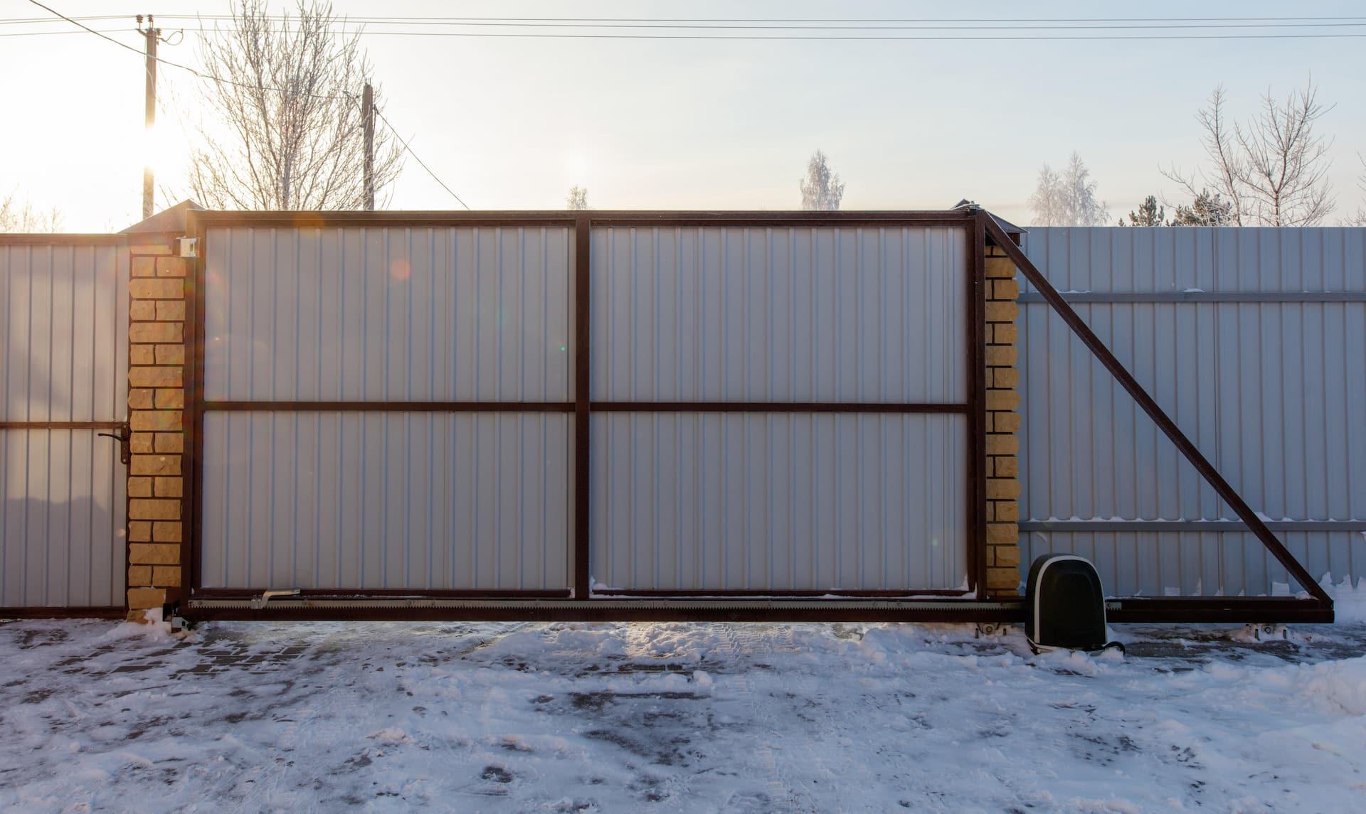 View of gate with snow on the ground