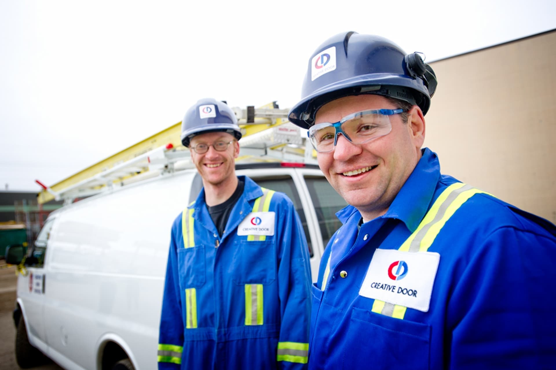 Creative Door Services repair technicians and van