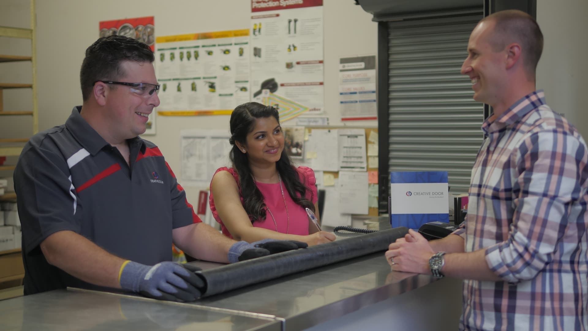 Creative Door Services parts department talking with client