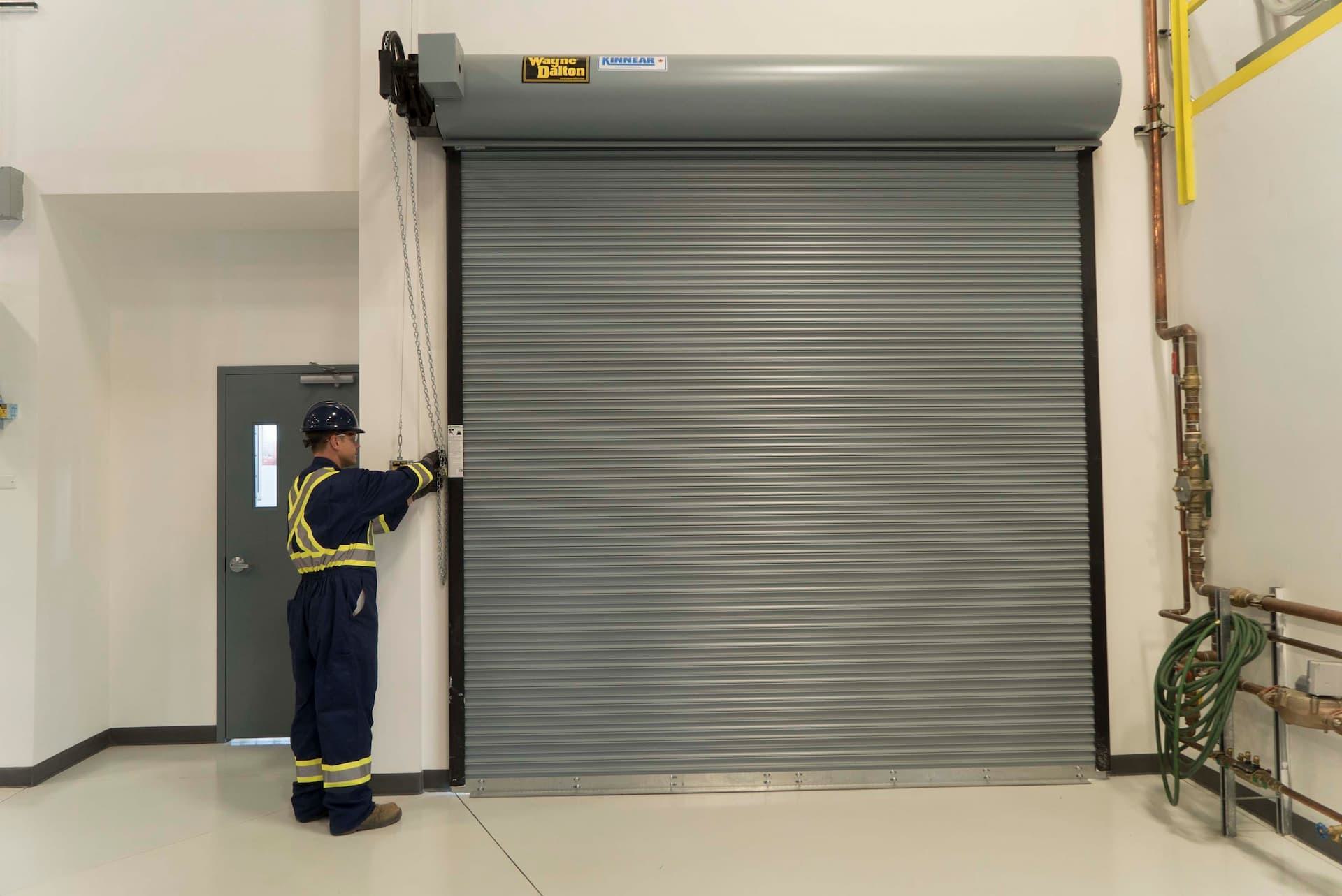 CDS technician inspecting rolling door