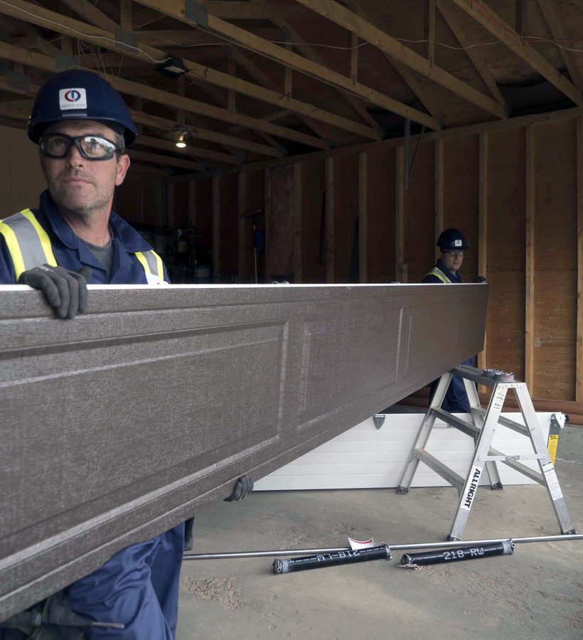 CDS technician installing a garage door panel