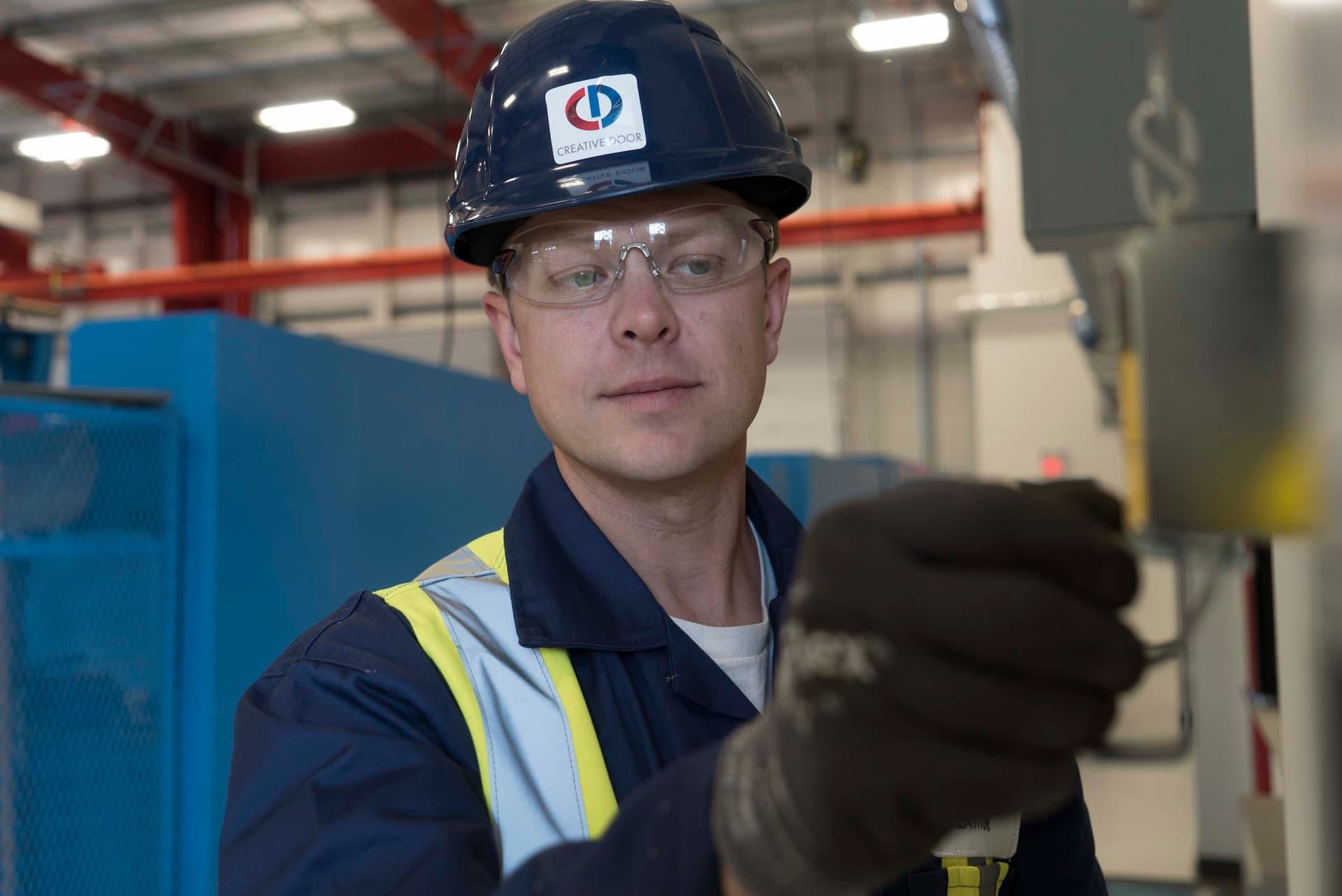 CDS technician installing pedestrian door component