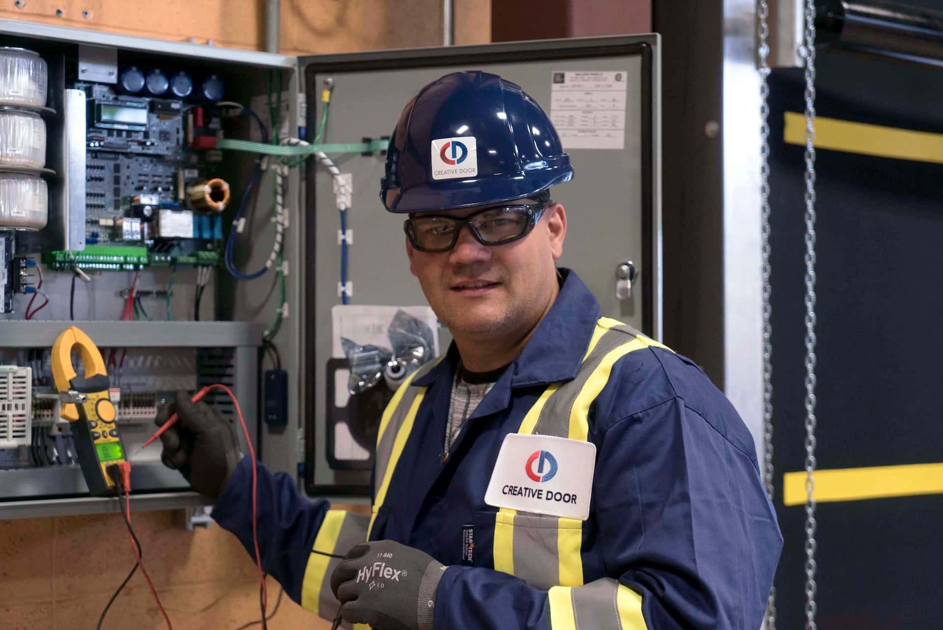 Creative Door Services technician testing door control system