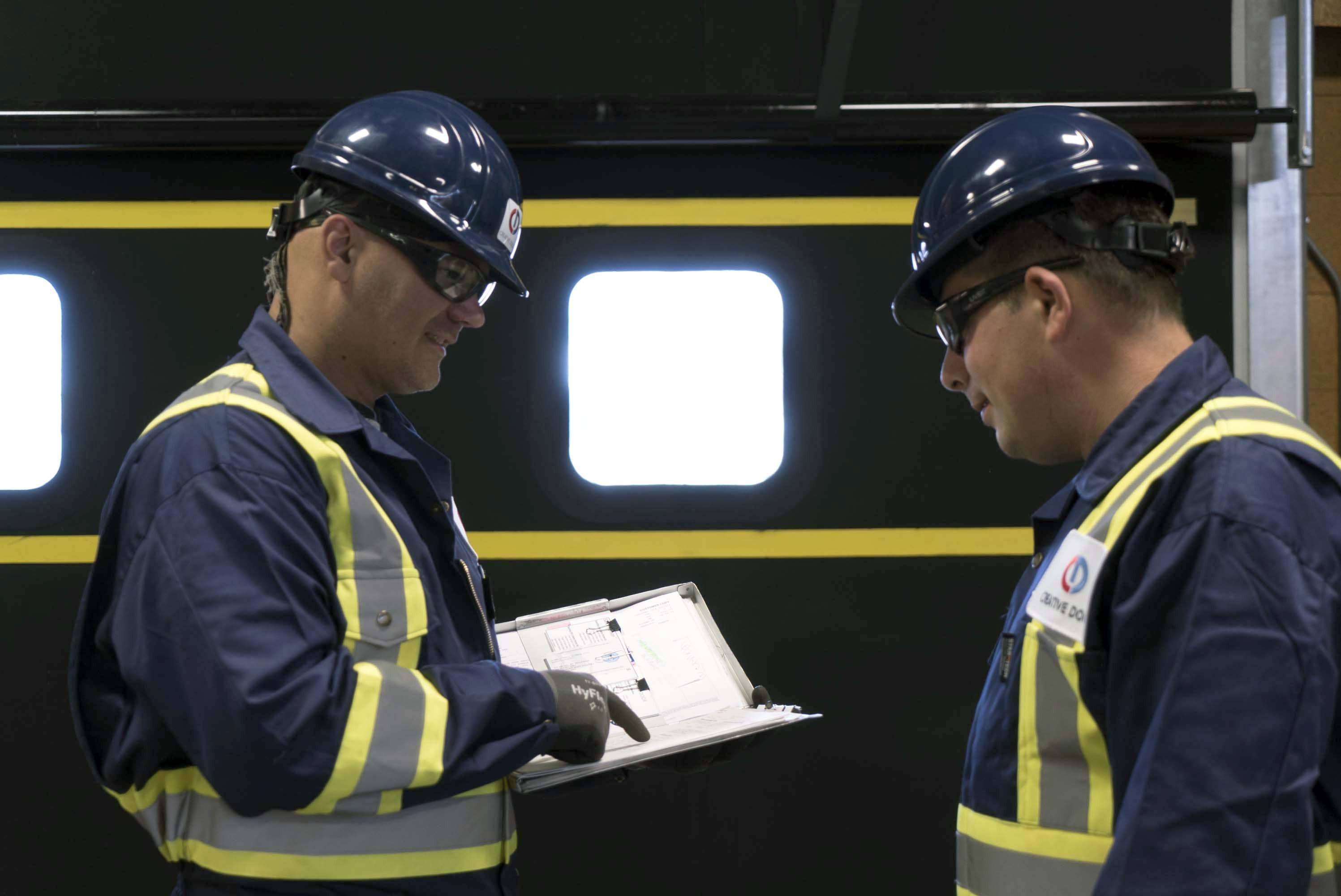 CDS technicians reviewing commercial door maintenance plan