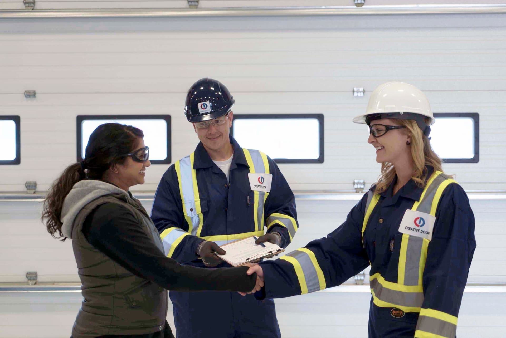 Commercial property manager meeting with Creative Door Services technicians