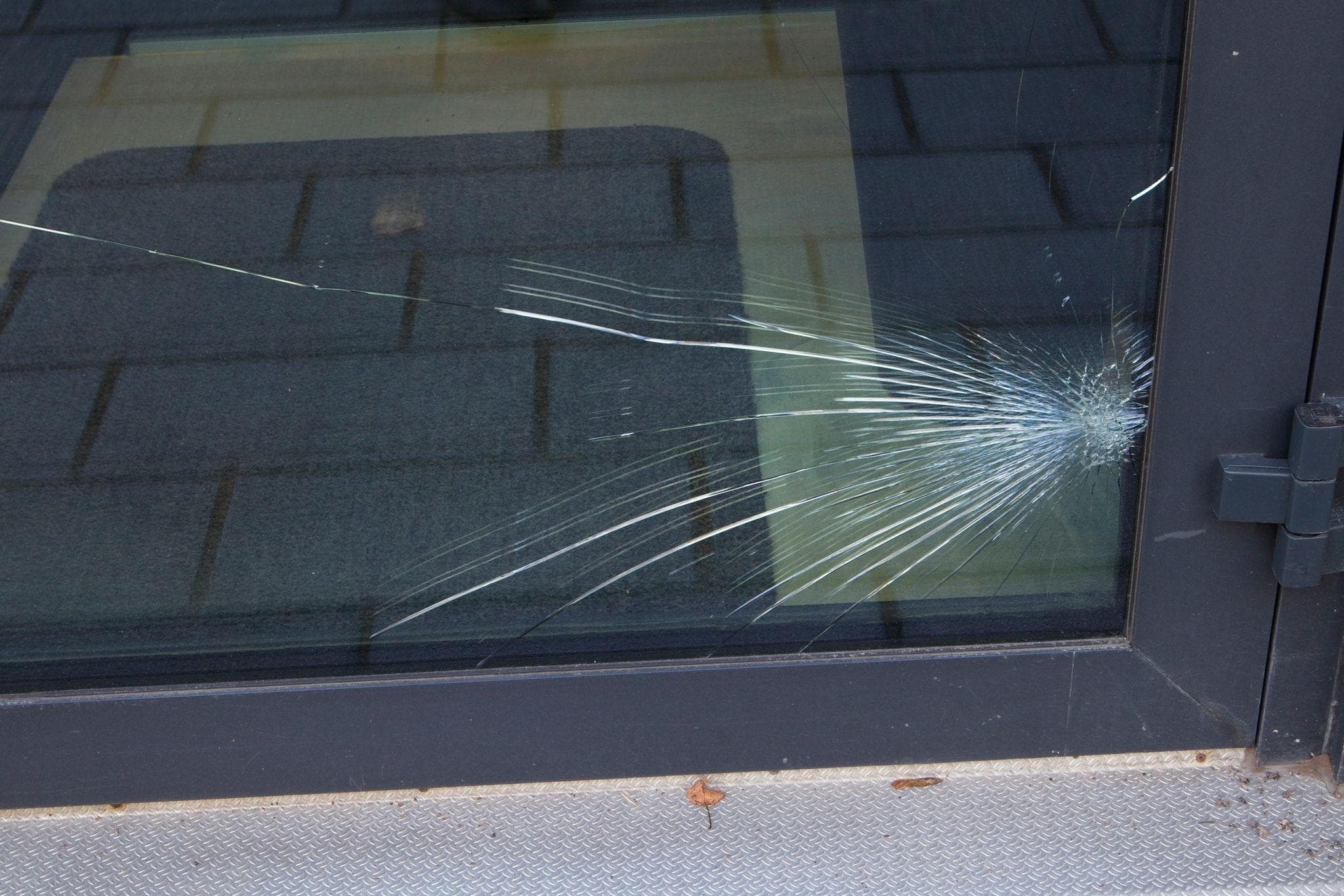 glass entry door cracked from impact