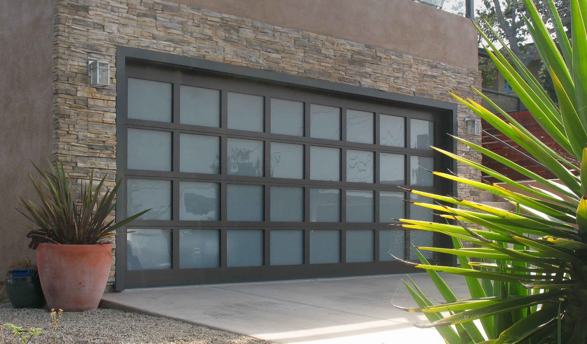 trendy glass pane garage door with black trim