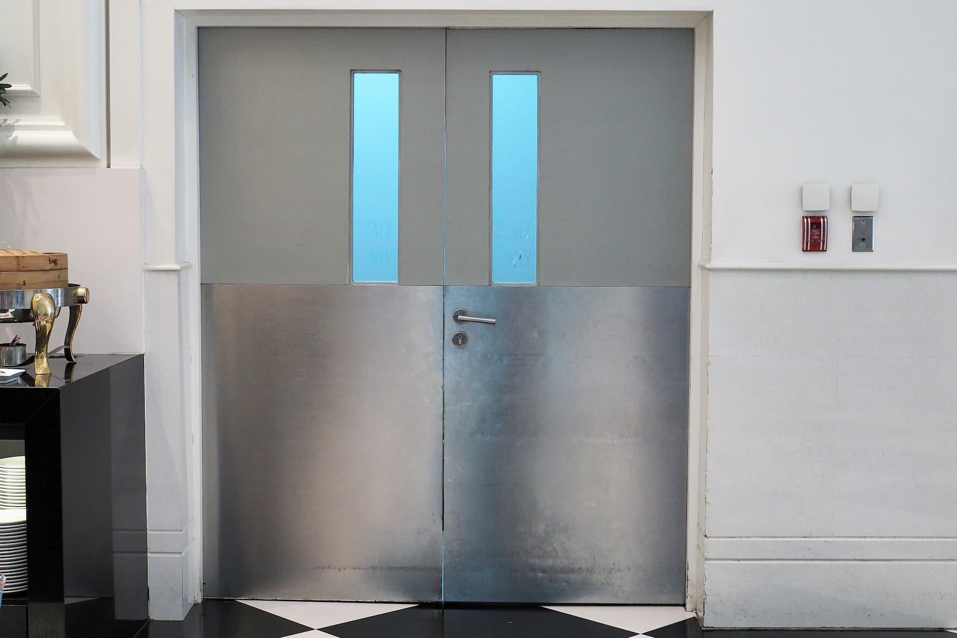 Double swing hollow metal door inside hotel kitchen