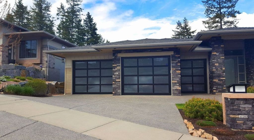 luxury home with double garage glazed glass doors