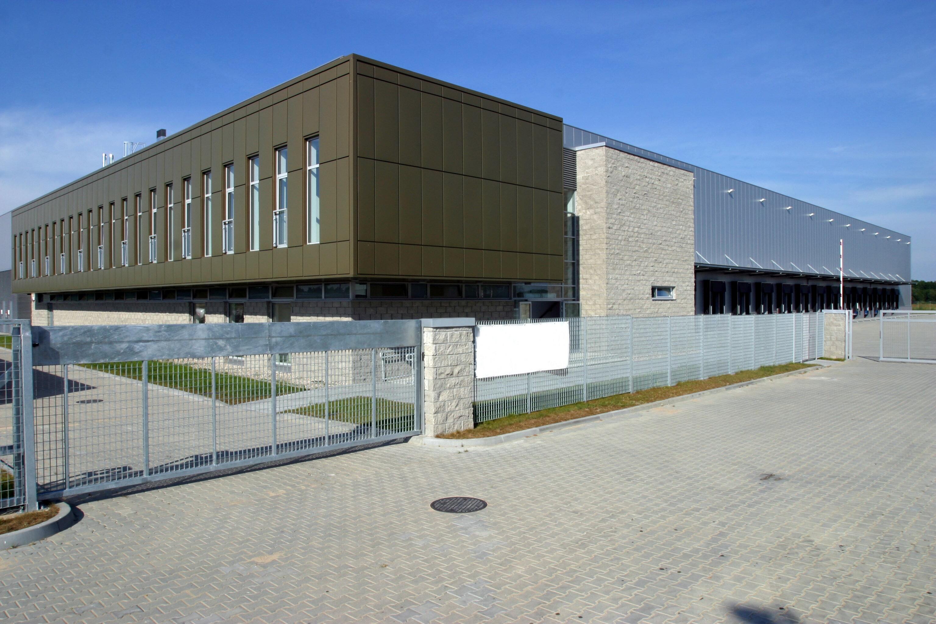 security gates around a large warehouse with multiple entrances visible