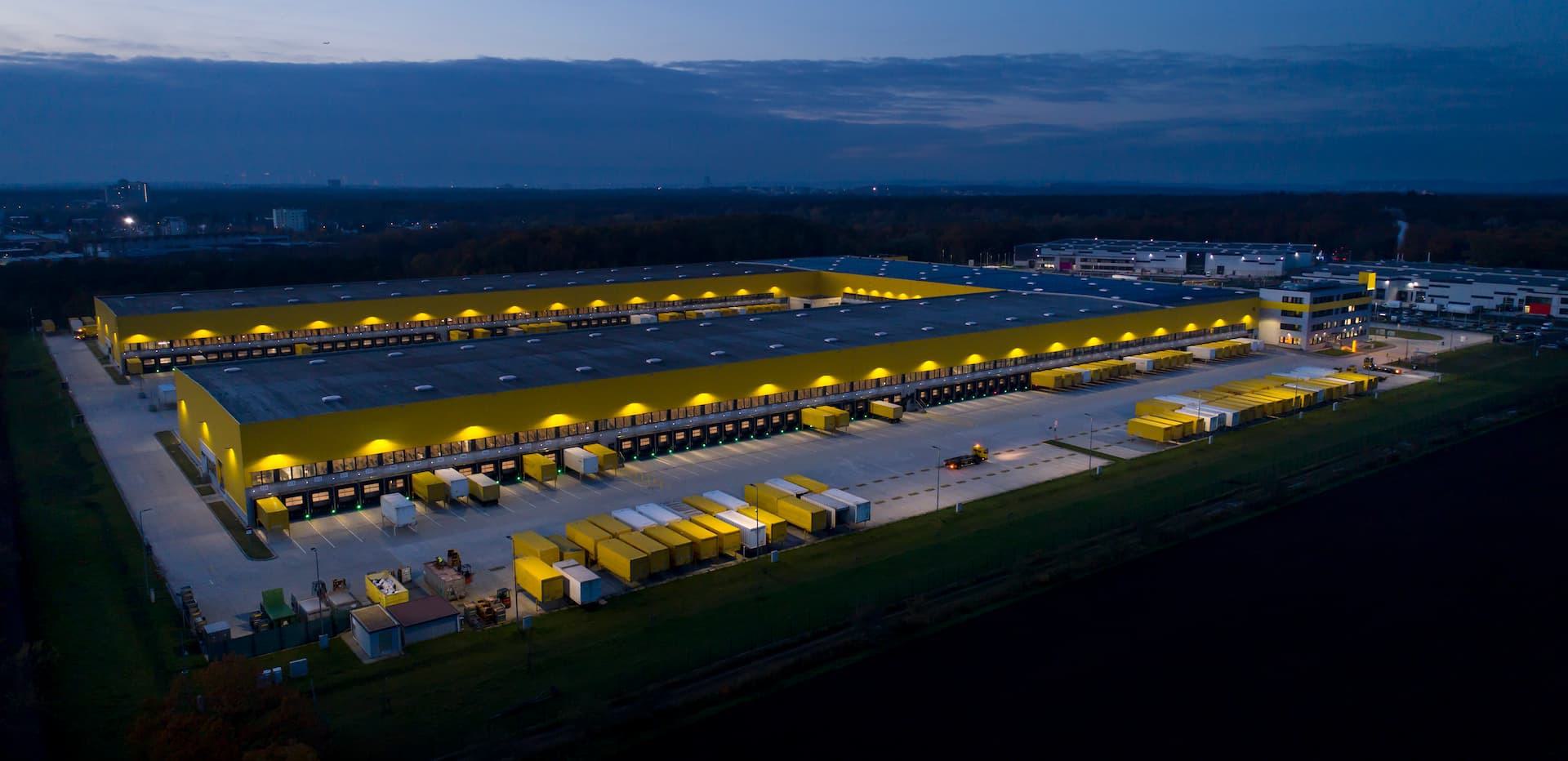 Overhead view of distribution center with lights on