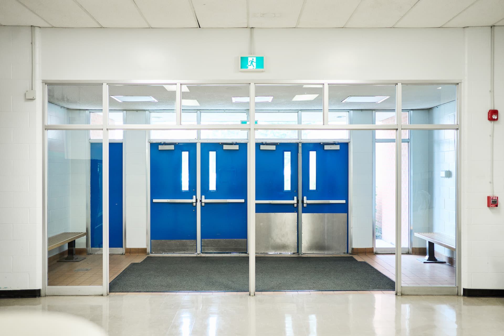 School entrance doors with panic hardware