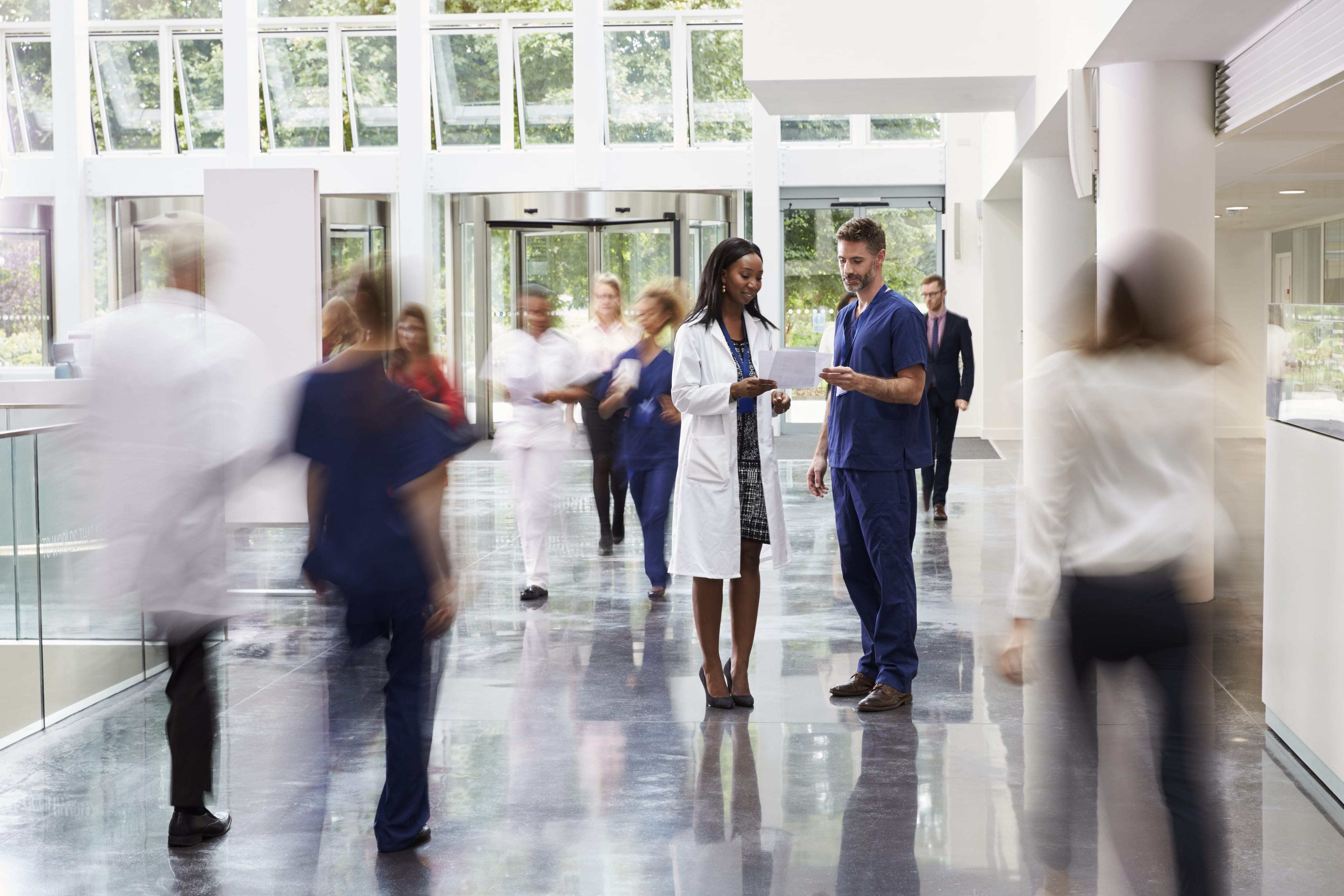 staff in busy hospital lobby