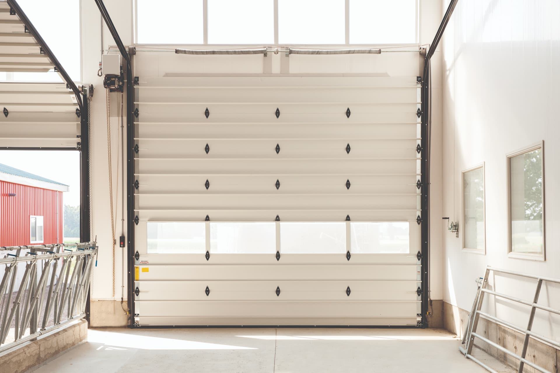 Wayne Dalton model 200 white commercial sectional door with aluminum full view lites