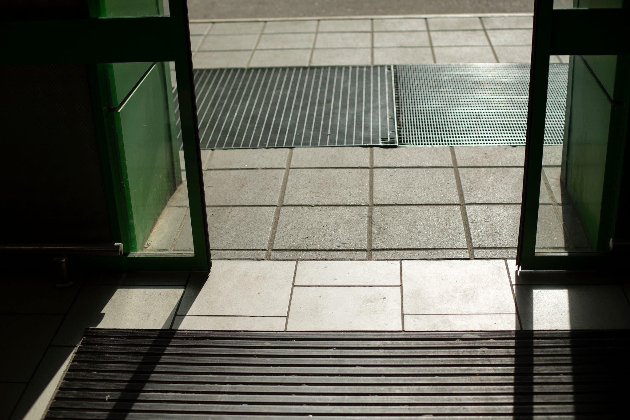 automatic glass sliding doors opening on to a sidewalk