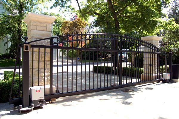 beautiful cantilever gate on a sunny residential property beautiful cantilever gate on a sunny residential property