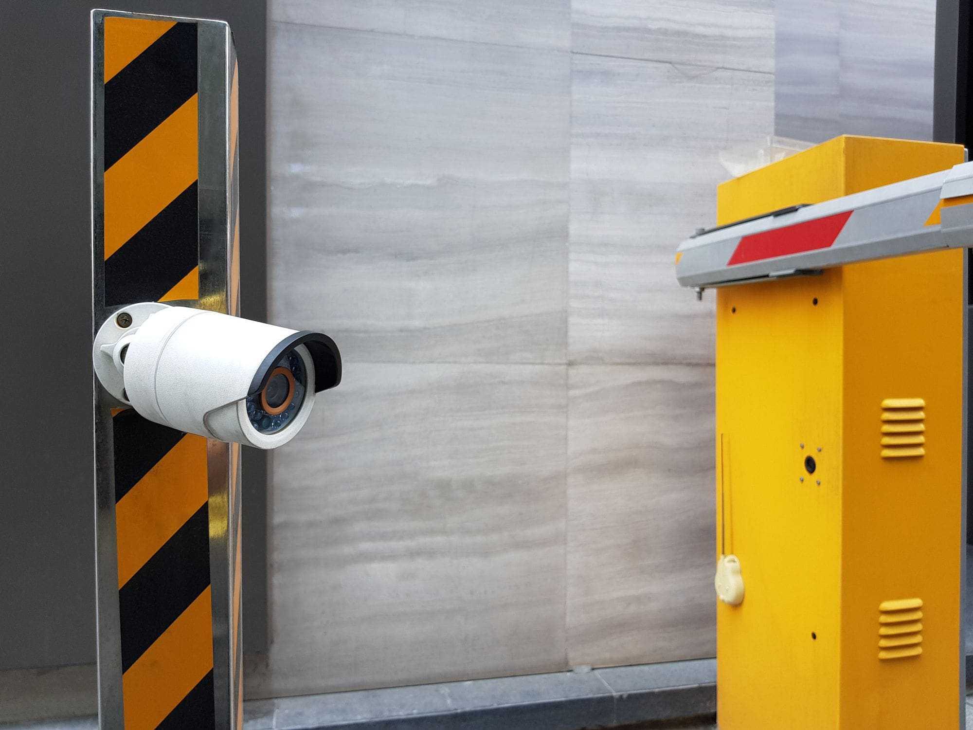 CCTV security camera at commercial automatic gate entrance CCTV security camera at commercial automatic gate entrance