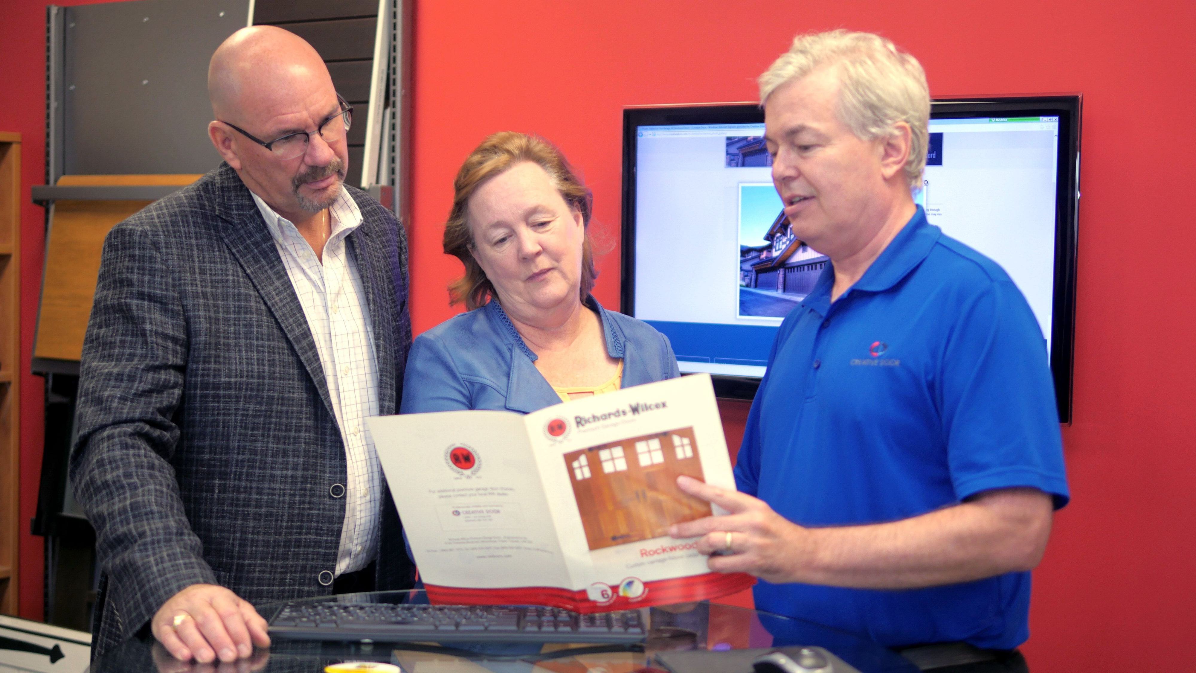 customer service representatives from creative door reviewing customization features