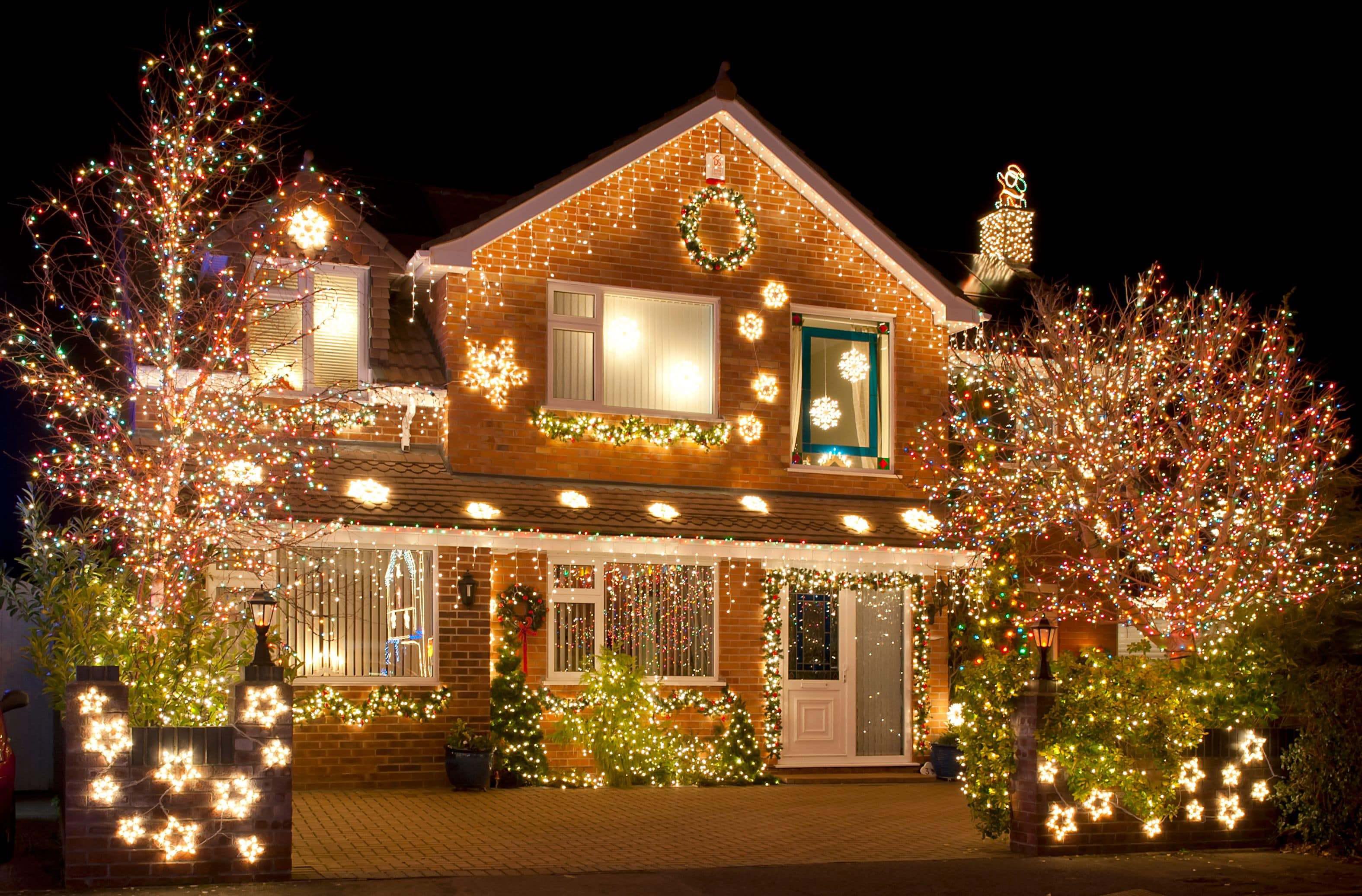 bright christmas lights on a beautiful festive house bright christmas lights on a beautiful festive house