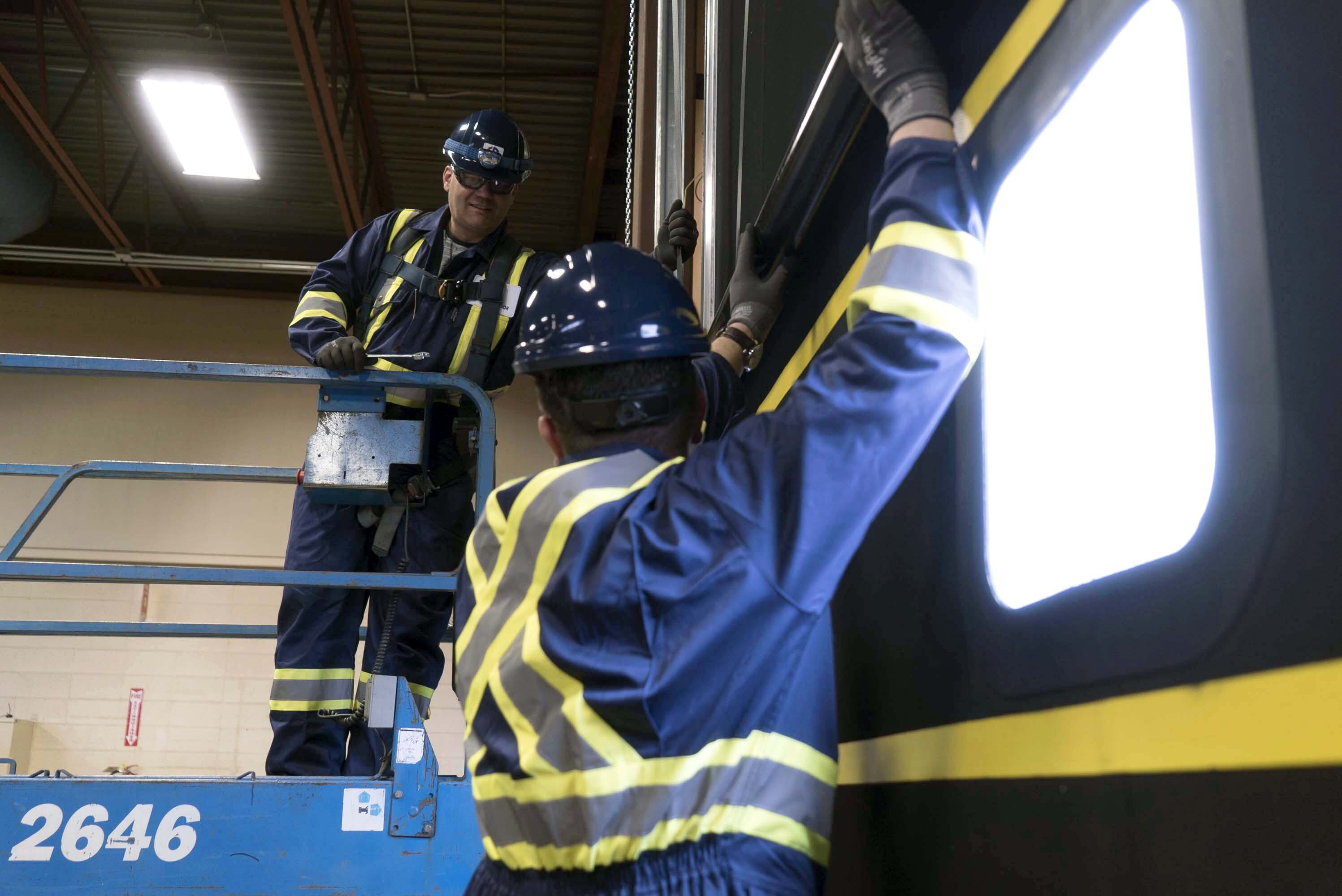 door technicians servicing a commercial door