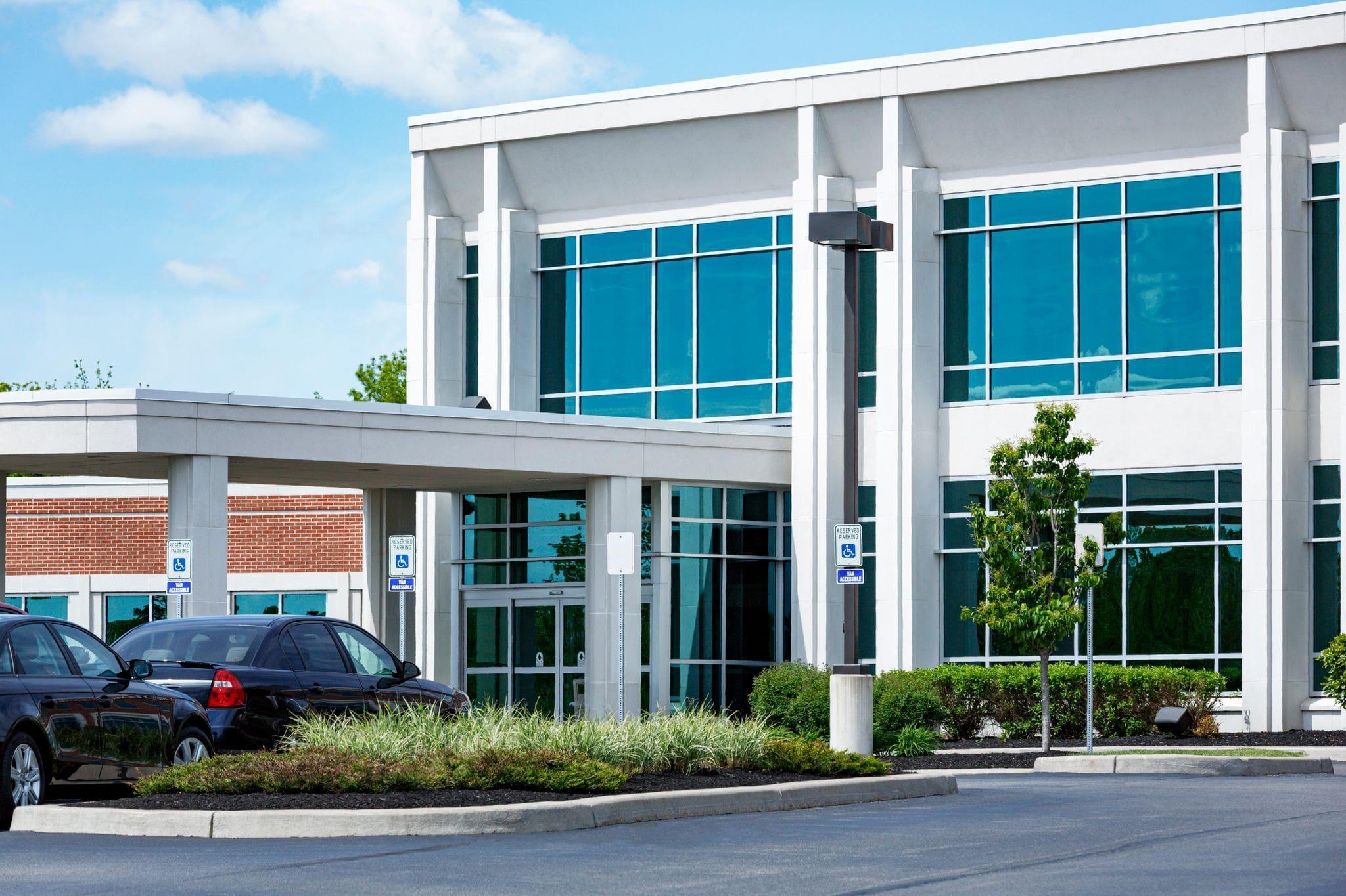 exterior of commercial plaza with new pedestrian commercial doors exterior of commercial plaza with new pedestrian commercial doors
