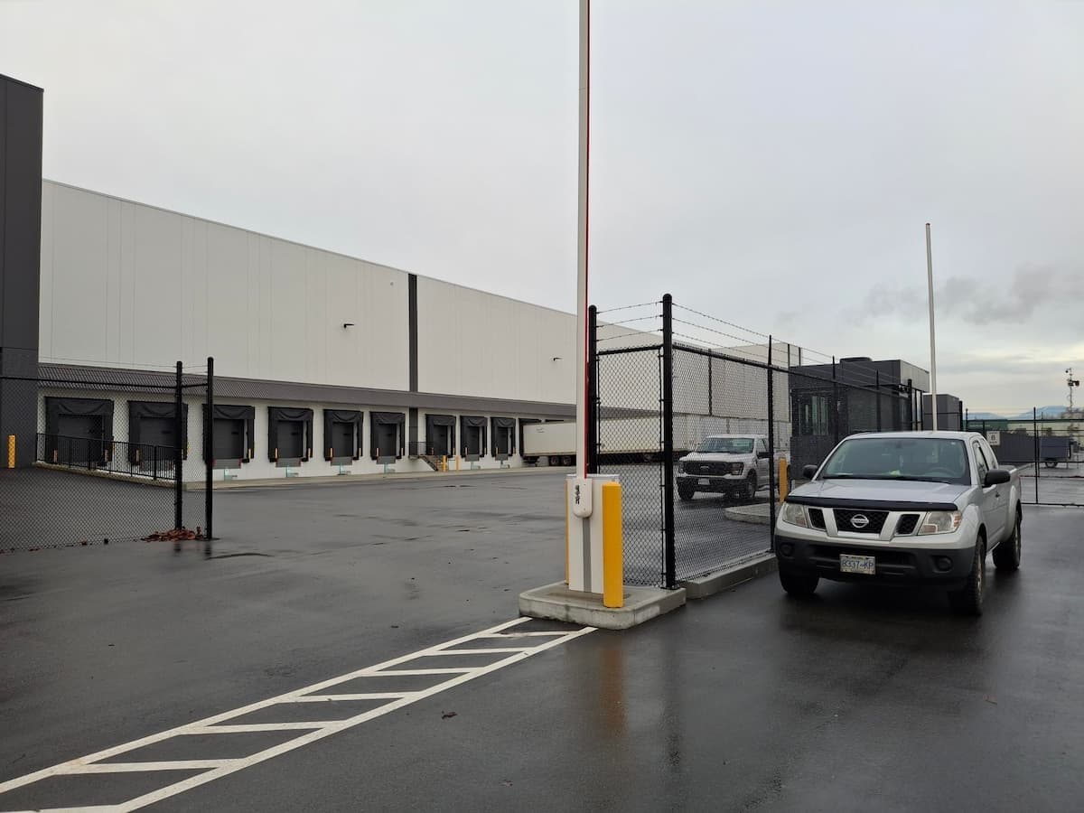 commercial facility with gated entrance and barrier arm