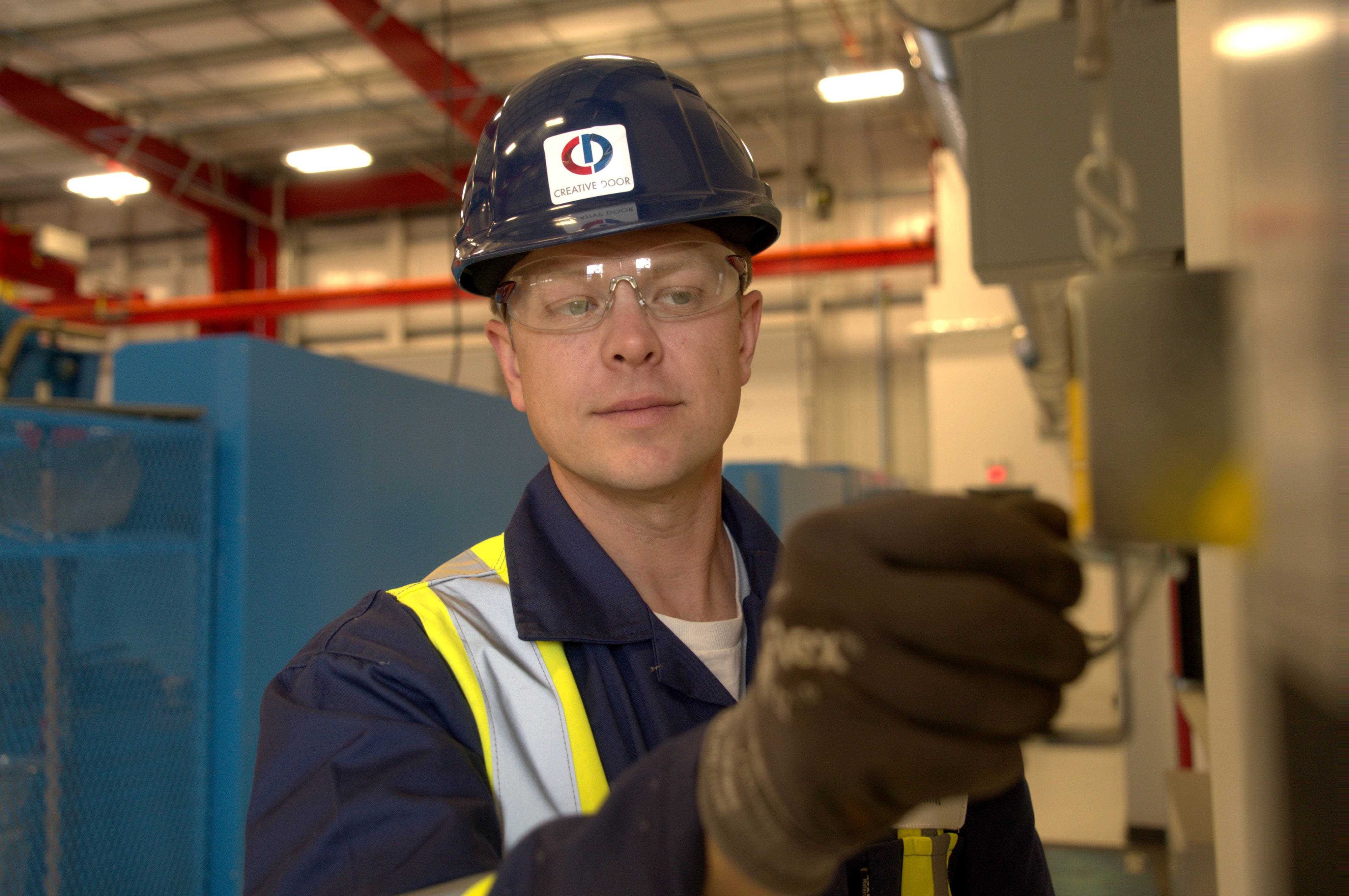 creative door technician installing wayne dalton high-performance doors creative door technician installing wayne dalton high-performance doors