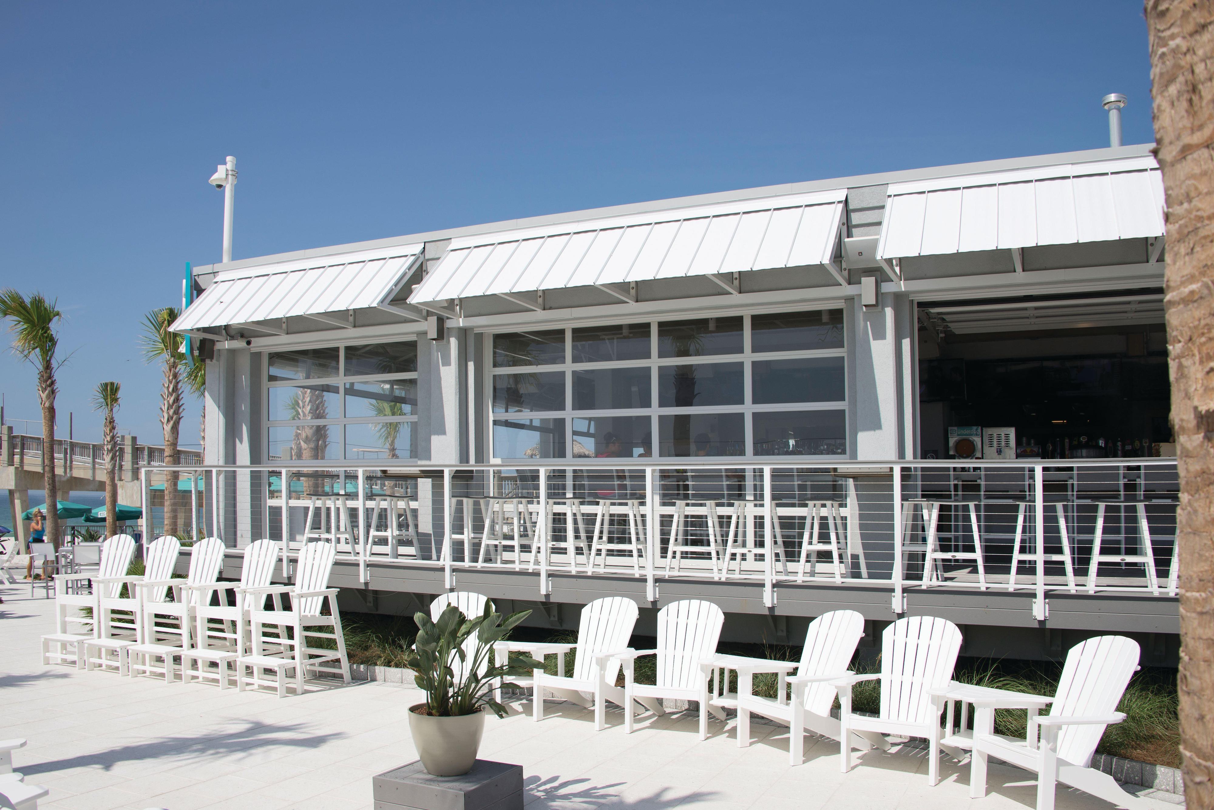 outdoor commercial building with large overhead commercial doors and glass outdoor commercial building with large overhead commercial doors and glass