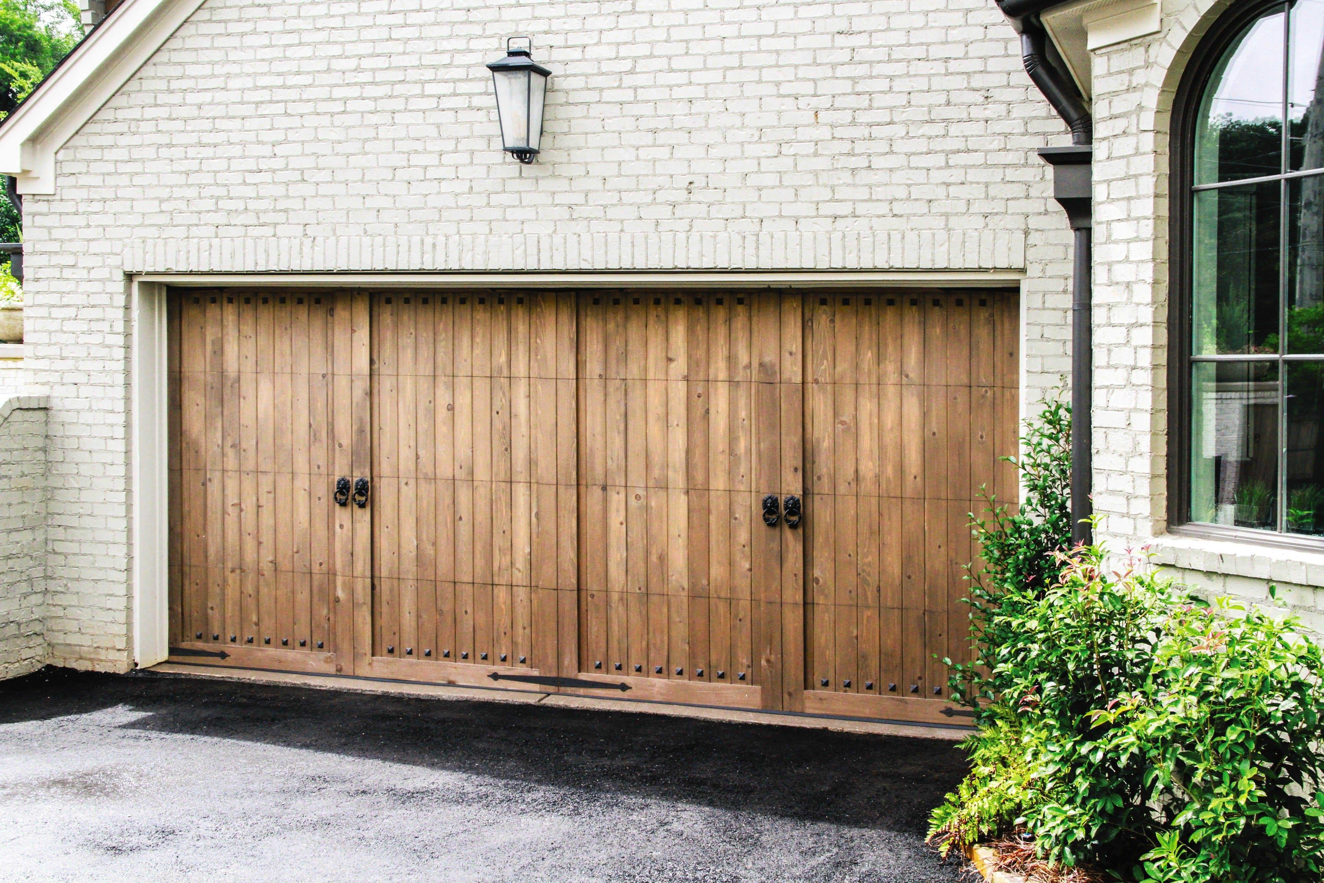 custom wood garage doors with antique handles