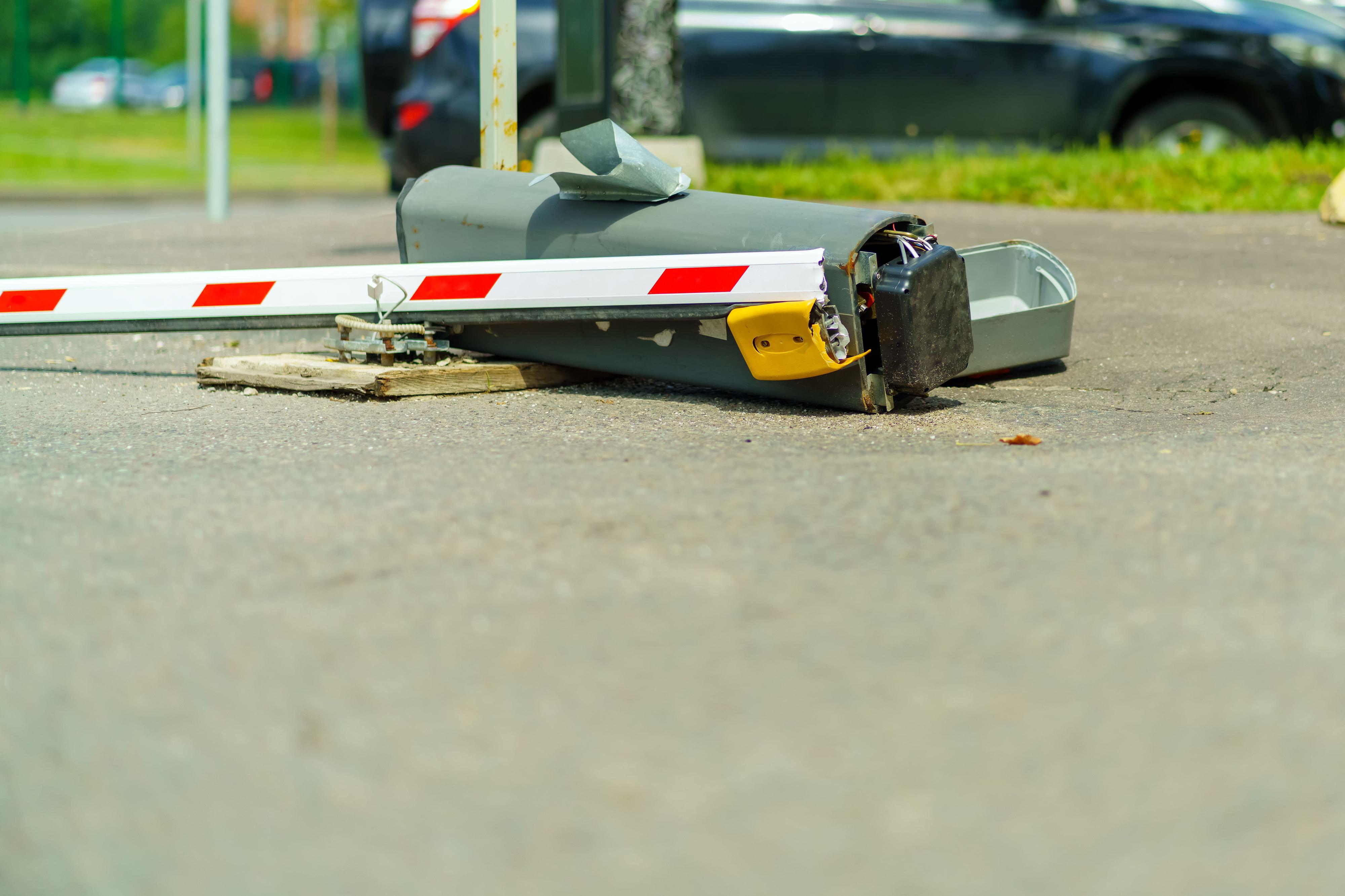 damaged barrier gate that has been run over by a vehicle