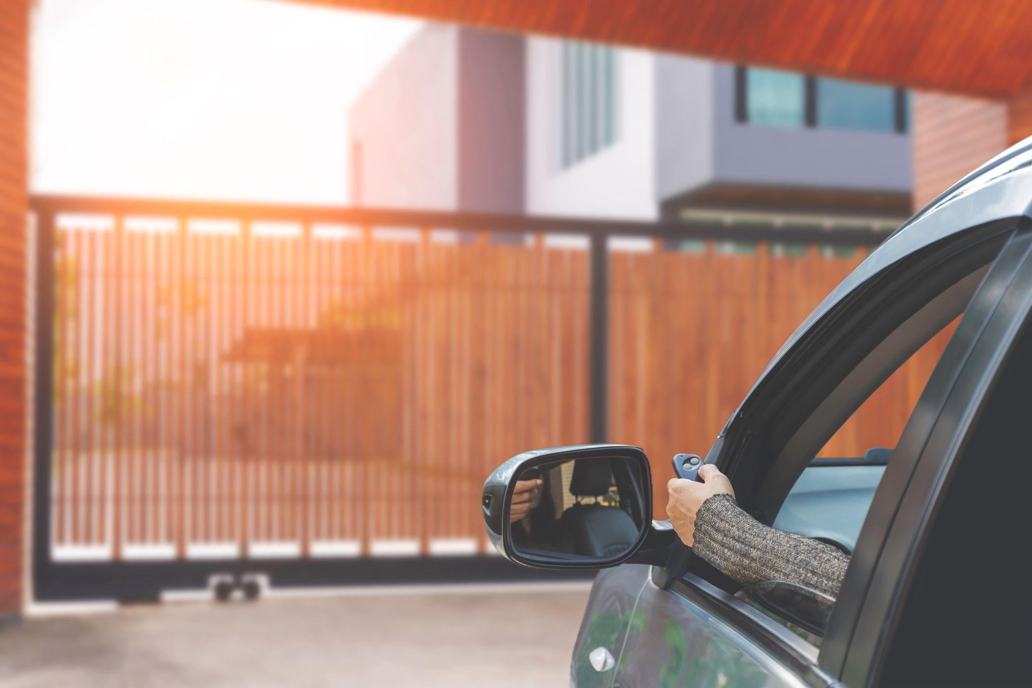 using remote to open driveway gate from car